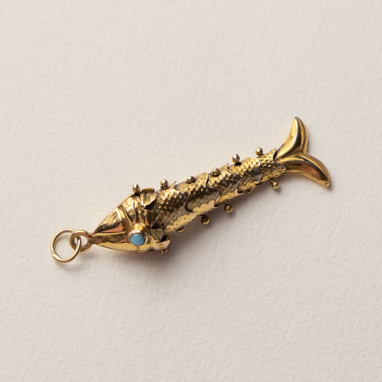 9 carat articulated fish pendant turqouis
