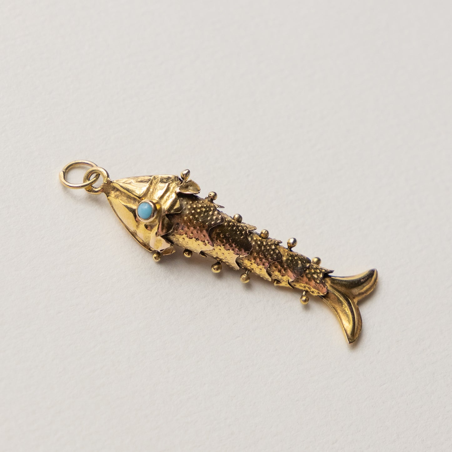 9 carat articulated fish pendant turqouis