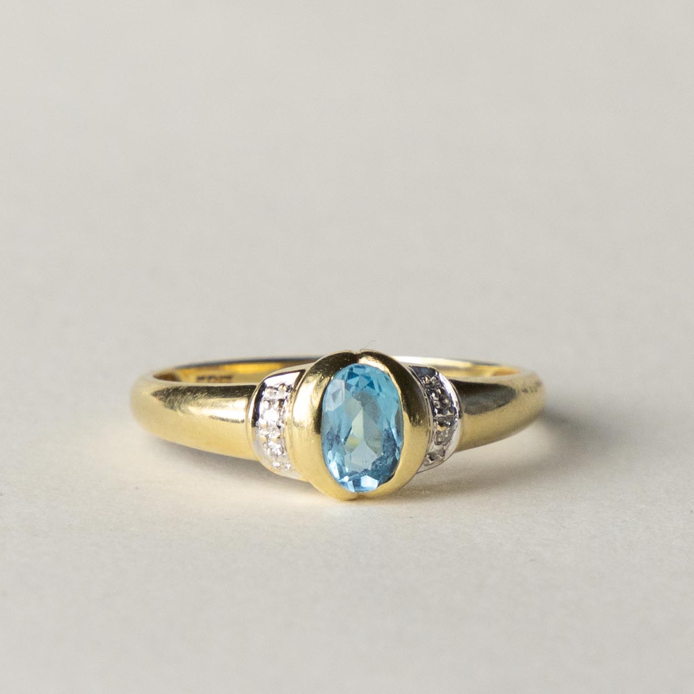 14ct blue topaz & diamond dress ring