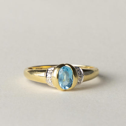 14ct blue topaz & diamond dress ring