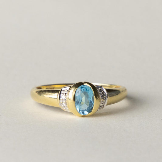 14ct blue topaz & diamond dress ring