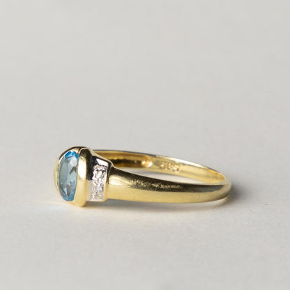 14ct blue topaz & diamond dress ring