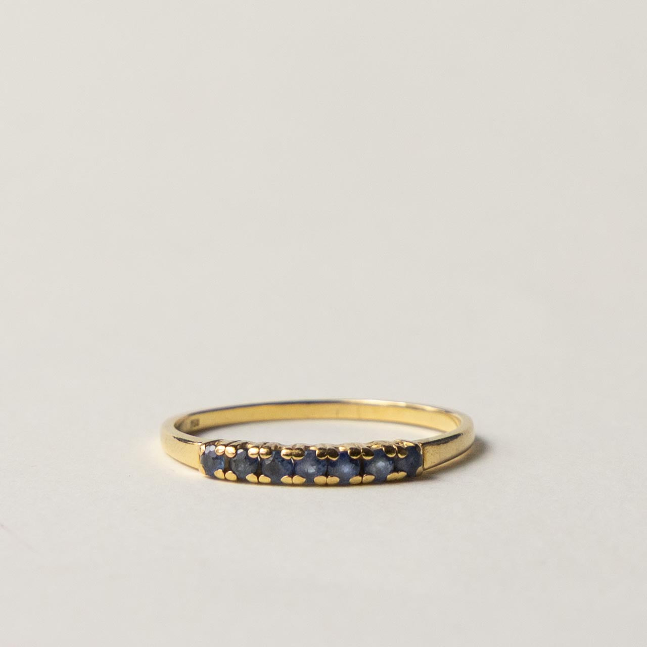 18ct saffire half eternity row ring