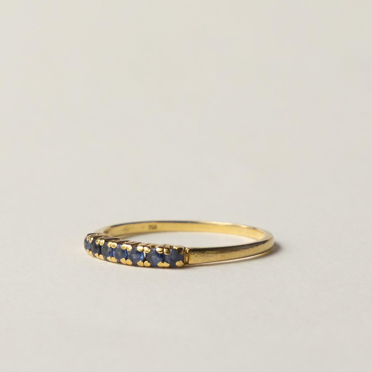 18ct saffire half eternity row ring