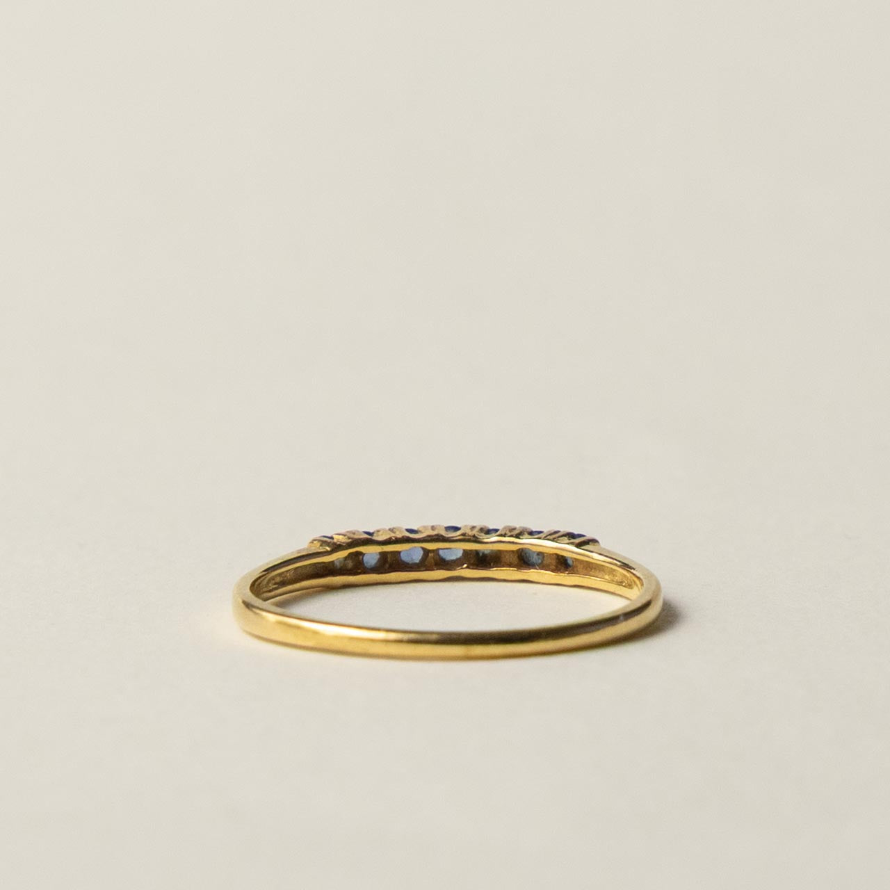 18ct saffire half eternity row ring