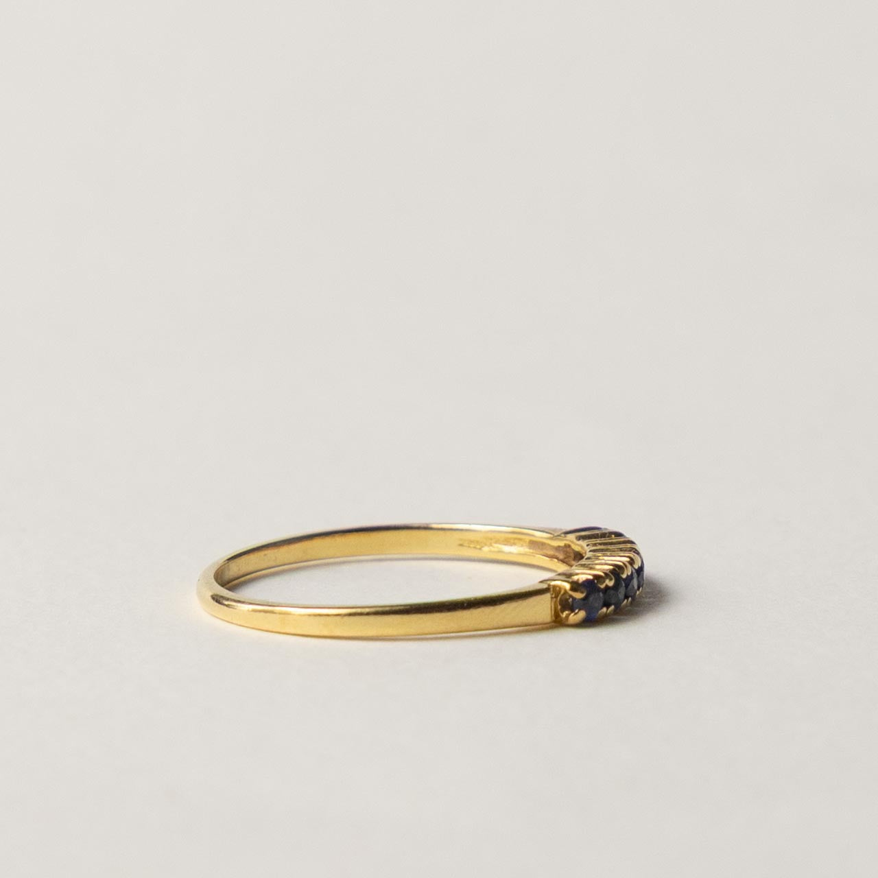 18ct saffire half eternity row ring