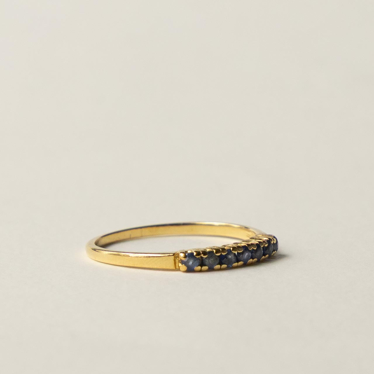 18ct saffire half eternity row ring