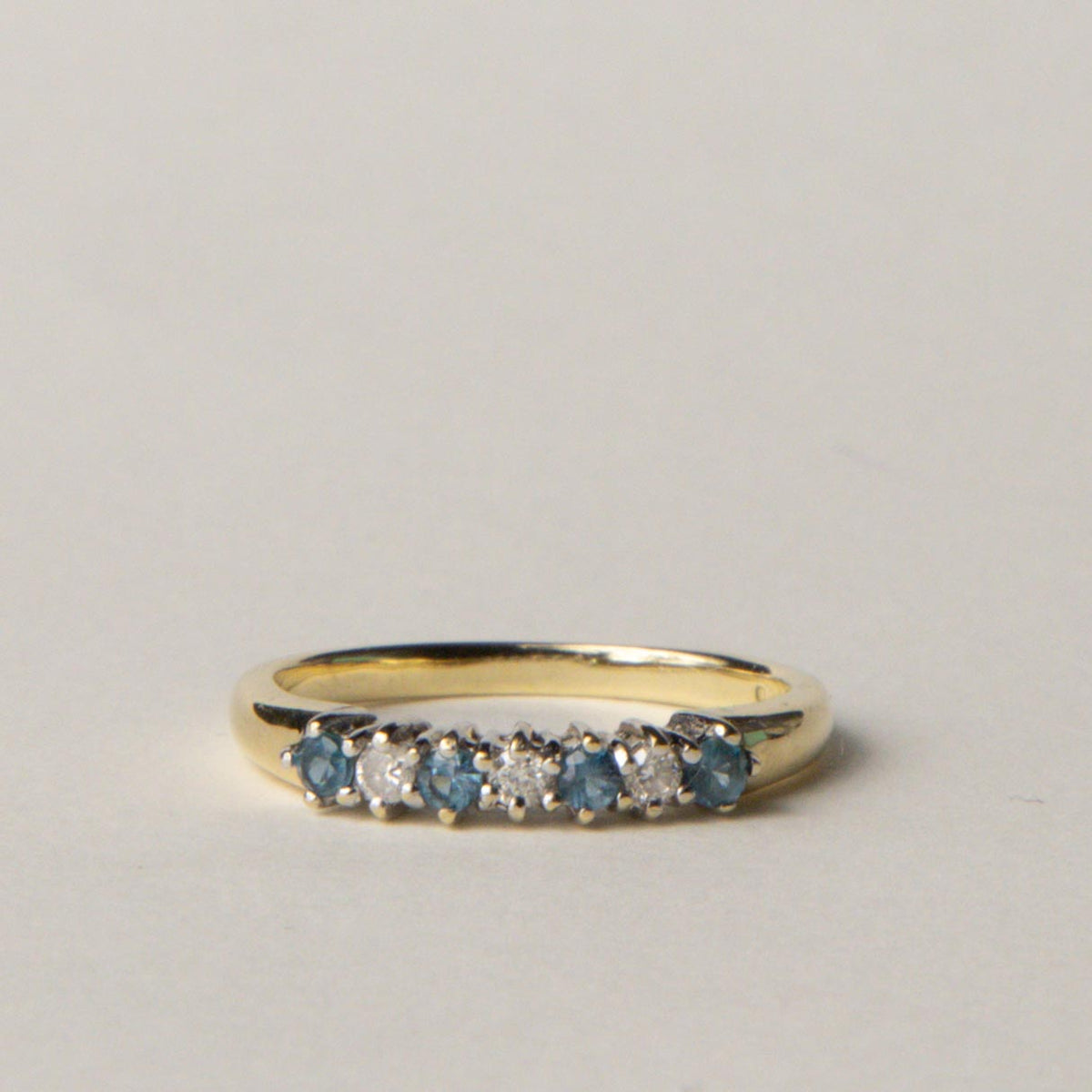 9ct blue topaz & diamond row ring