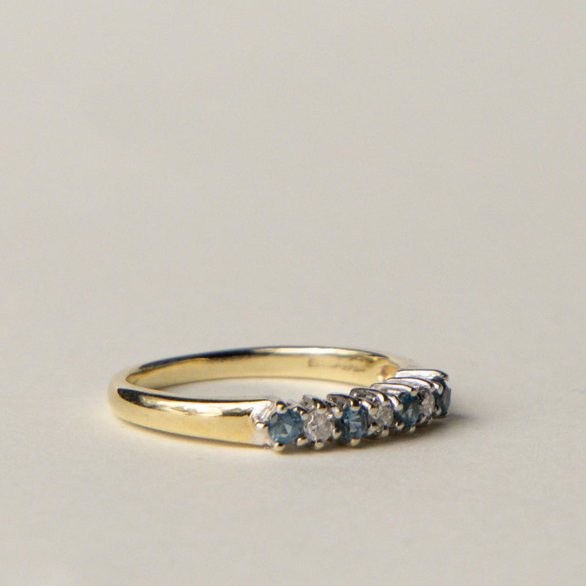9ct blue topaz & diamond row ring