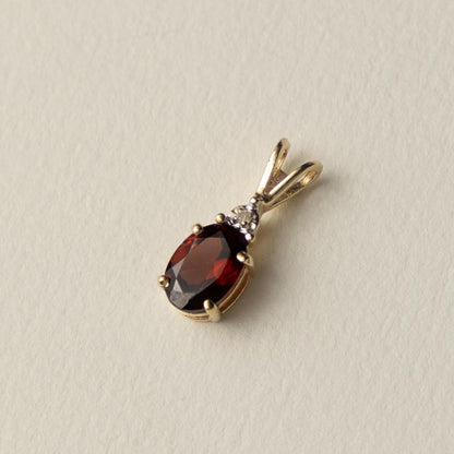9ct garnet & diamond pendant