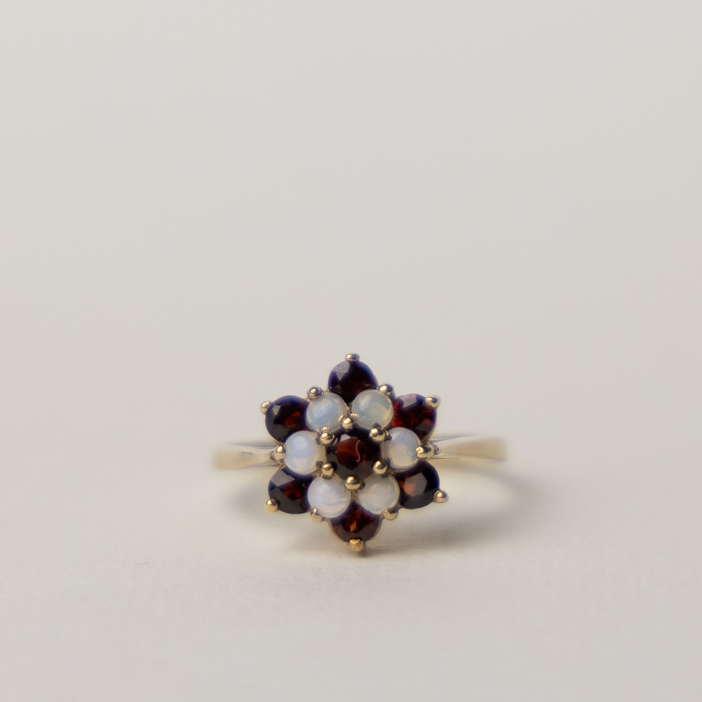 9 carat gold cluster garnet opal ring